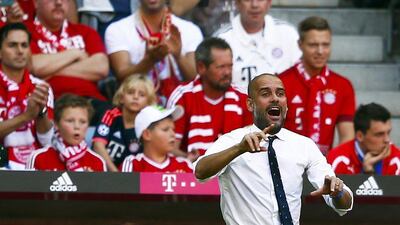 Bayern Munich manager Pep Guardiola gestures during the team's Bundesliga win over Augsburg on Saturday. Michael Dalder / Reuters / September 12, 2015