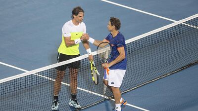 Rafael Nadal and David Ferrer greet each other at the net after their semi-final match. Mona Al Marzooqi/ The National