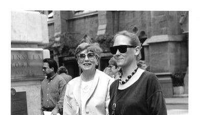The photo is of me (Liz Claus) and my mother (Dorothy Claus), walking down Fifth Avenue sometime in the late 1980s or early 90s. We had just had lunch at Henri Bendel - one of our favourite spots, when Bill Cunningham jumped out and snapped the pic. I was surprised, but Mom saw him right away. When I saw him in the office later, he clipped the negative (there was only one frame), and gave it to me. When I look at that photo now, I see how it's a quintessential Bill Cunningham photo. I was unaware at the time that we were dressed so similarly but in opposite colours; same bag, too! I'm sure Bill would have remembered exactly what year the photo was taken. Photo by Bill Cunningham