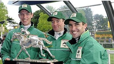 The Irish jockeys Richard Hughes, left, Seamie Heffernan, centre, and Neil Callan celebrate their team victory in the Shergar Cup riders' championship at Ascot.