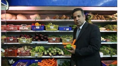 Yousrey Elsharkawi, a food business consultant. examines local produce at a supermarket in the Abu Hail area in Deira. Pawan Singh / The National