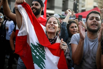 Lebanese anti-government protesters celebrate the resignation of Prime Minister Saad Hariri in Beirut on October 29, 2019 on the 13th day of anti-government protests. AFP