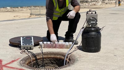 A Kando employee uses equipment to detect coronavirus in wastewater in Israel. Kando