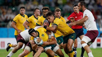 Australia's fly-half Christian Lealiifano is tackled against Georgia. AFP