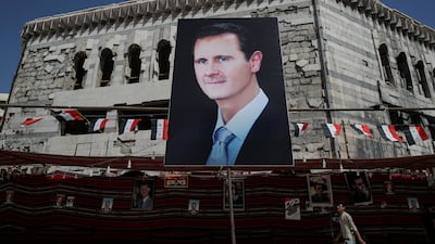 A poster of Syrian President Bashar Al Assad in Douma, outside Damascus, Syria. Reuters