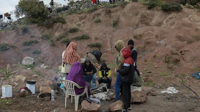 Migrants from sub-Saharan African countries who arrived on the island of Lesbos remain in quarantine in an open space designated by the Greek authorities, on the island of Lesbos, as Greece tries to control the spread of the novel coronavirus Covid-19. AFP