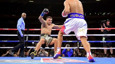 Gennady Golovkin knocks down Sergiy Derevyanchenko in the first round during their IBF middleweight title bout at Madison Square Garden. AFP