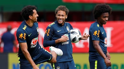 Neymar, centre, remains the star of Brazil but the burden of carrying the hopes of a nation no longer solely rest on his shoulders. Leonhard Foeger / Reuters