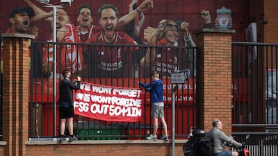 Supporters protest against Liverpool's US owner John W. Henry and the Fenway Sports Group (FSG) outside Liverpool's Anfield Stadium. AFP