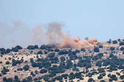 Smoke rises from hills above the souther Lebanese village of Maroun Al Ras, opposite the Israeli Moshav of Avivim during Israeli artillery shelling on October 25, 2023. AFP
