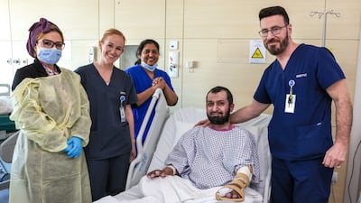 Patient Nawab Shahnawaz with Sheikh Shakhbout Medical City staff members, from left to right, Ranya Shehab, Zaskia Ezendam, Biji Varghese and Dr Simon Myers. All photographs: Victor Besa / The National