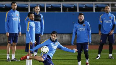 Barcelona’s Luis Suarez kickss the ball during training on Monday in Japan. Toru Hanai / Reuters
