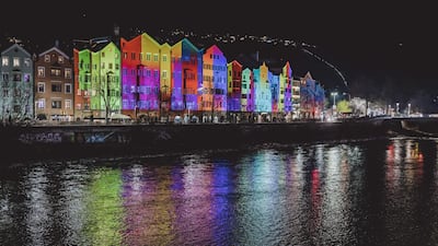 Facades of houses at Mariahilf are illuminated to celebrate the New Year 2023 in Innsbruck, Austria, on December 31, 2022. AFP