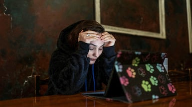 An Iranian woman reacts as she struggles to access the internet amid nationwide disruptions. Reuters