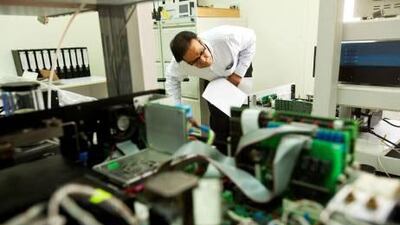 Muhammed Azam calibrates a hydrocarbon sensor at a workshop hosted by the Norwegian Institute of Air Research. Christopher Pike / The National
