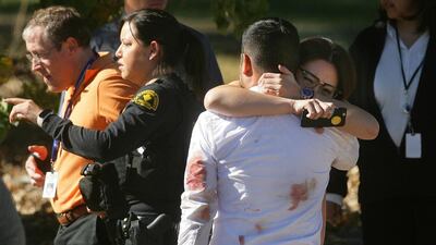A couple embraces following the mass shooting that killed 14 people in San Bernardino, California on December 2. David Bauman/The Press-Enterprise via AP