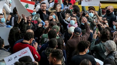 Students from different universities carry placards, wave Lebanese flags during a demonstration under the slogan of 'A Day of Student Rage' in Al-Hamra, Beirut. EPA