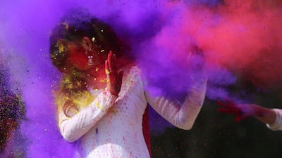 Indian college girls throw coloured powder to one another during Holi festival celebrations in Bhopal on February 28, 2018. Holi, the popular Hindu spring festival of colours, is observed in India at the end of the winter season on the last full moon of the lunar month, and will be celebrated on March 1 this year. AFP