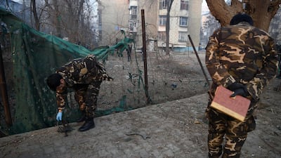 Afghan security personnel investigate the site of the January 4 suicide attack in Kabul on January 5, 2018. Wakil Kohsar / AFP Photo