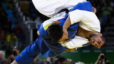 Georgia’s Beka Gviniashvili, blue, competes against Belgium’s Toma Nikiforov during the men’s 100-kg judo competition at the 2016 Summer Olympics in Rio de Janeiro, Brazil, Thursday, August 11, 2016. Markus Schreiber / AP Photo