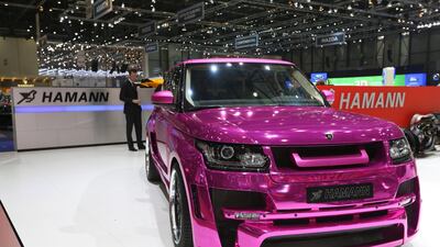 A purple Range Rover automobile customized by Hamann on display at the Geneva International Motor Show. Chris Ratcliffe / Bloomberg