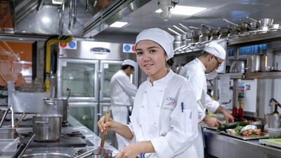 Kamila Madalinova finds preparing food at the Emirates Academy of Hospitality Management hot work. Victor Besa for The National