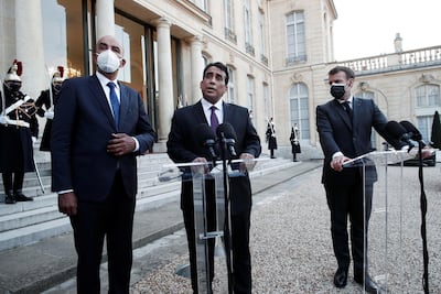 The three speak in the grounds of the Elysee Palace. Reuters