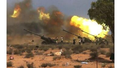 NTC fighters fire howitzers at pro-Qaddafi forces east of the city of Sirte yesterday. Asmaa Waguih / Reuters