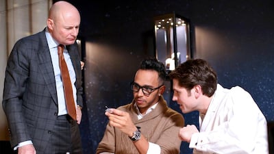 IWC Schaffhausen CEO George Kern and Lewis Hamilton visit the IWC booth during the Salon International de la Haute Horlogerie (SIHH) 2015 at the Palexpo on January 20, 2015 in Geneva, Switzerland. Chris Jackson / Getty Images for IWC