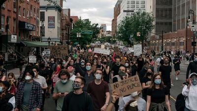 NEW YORK, NY - JUNE 02: Protesters denouncing police brutality and systemic racism march in the street in the Brooklyn borough of New York City. Days of protest, sometimes violent, have followed in many cities across the country in response to the death of George Floyd while in police custody in Minneapolis, Minnesota on May 25th. Scott Heins/Getty Images/AFP == FOR NEWSPAPERS, INTERNET, TELCOS & TELEVISION USE ONLY ==