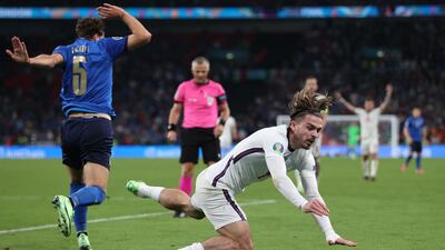 Italy midfielder Manuel Locatelli fights for the ball with England midfielder Jack Grealish during the final of Euro 2020. AFP