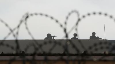 US embassy security personnel take their position on the roof. Reuters