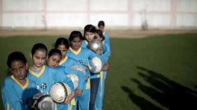 Palestinian girls tarining at the Beit Lahia football club in the northern Gaza strip as part of an after-school sport program funded by the Palestine Association for Children’s Encouragement of Sports. Mahmud Hams / AFP