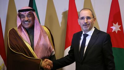Kuwaiti Foreign Minister Sheikh Sabah Khaled Al Hamad Al Sabah greets Jordanian Foreign Minister Ayman Safadi as he arrives for the meeting. AFP