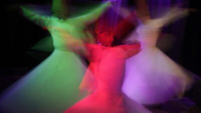 Egyptian dancers in traditional costumes perform Sufi dance known as "Whirling dervish." in Cairo, Egypt. Amr Nabil / AP Photo
