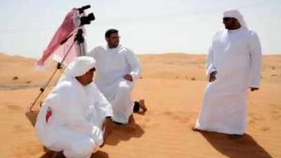 Saeed al Dhaheri, kneeling beside the camera while filming The Rescue , says that whenever he feels he is getting tired or sick, he turns to filmmaking as a way of escape.