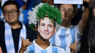 An Argentina fan wearing a Lionel Messi mask during the match against Iraq at the Prince Faisal bin Fahd Stadium in Riyadh, Saudi Arabia. Reuters
