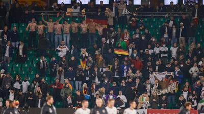 Germany fans take their shirts off to show a thank you message for former Germany head coach Joachim Low as a tribute to the World Cup winning coach. AFP