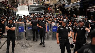 Police officers assemble to deal with the protest in Istanbul. AP