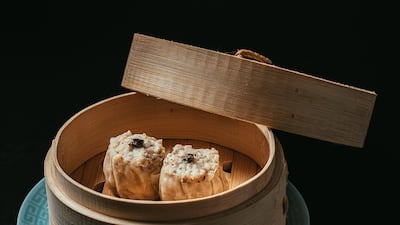The unassuming-looking siu mai comes with a runny quail egg yolk within