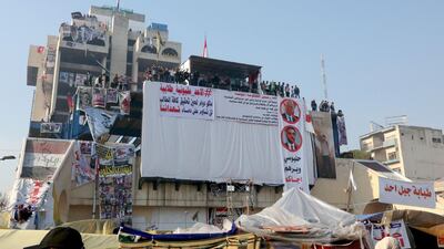 Iraqi anti-government protesters rally during ongoing demonstrations in the capital Baghdad's Tahrir square. AFP