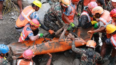 A worker is extracted from a tunnel connected to a hydropower station in Nepal, nine days after becoming trapped. EPA