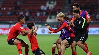 DUBAI, UNITED ARAB EMIRATES - JANUARY 22: Kim Jin-Su of South Korea (2L) celebrates as he scores his team's second goal with team mates during the AFC Asian Cup round of 16 match between South Korea and Bahrain at Rashid Stadium on January 22, 2019 in Dubai, United Arab Emirates. (Photo by Francois Nel/Getty Images)