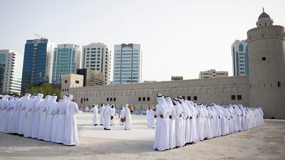 Traditional dancers perform during the group wedding.