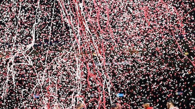 Confetti falls on head coach Ryan Day, Justin Fields #1 and Tuf Borland #32 of the Ohio State Buckeyes after they defeated the Clemson Tigers 49-28 during the College Football Playoff semifinal game at the Allstate Sugar Bowl at Mercedes-Benz Superdome in New Orleans, Louisiana. AFP