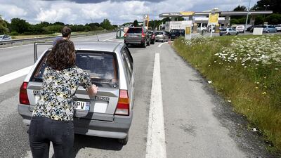 Some drivers in France have been left stranded following blockades of fuel depots by protesters angry over government labour reforms. AFP/Damien Meyer