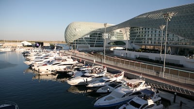 Boats at Yas Marina are one of the many ways people experience race-week glamour beyond the pit lane. Fatima Al Marzouqi / The National