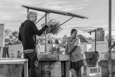 Alfonso Cuaron, left, and Yalitza Aparicio on the set of 'Roma'. AP