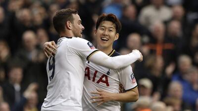 Tottenham's Son Heung-min celebrates with Vincent Janssen, left, after scoring his third goal during the English FA Cup quarter-final against Millwall at White Hart Lane in London, Sunday, March 12, 2017. Matt Dunham / AP Photo