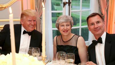 Donald Trump, Theresa May and Foreign Secretary Jeremy Hunt at the Return Dinner at Winfield House. AP